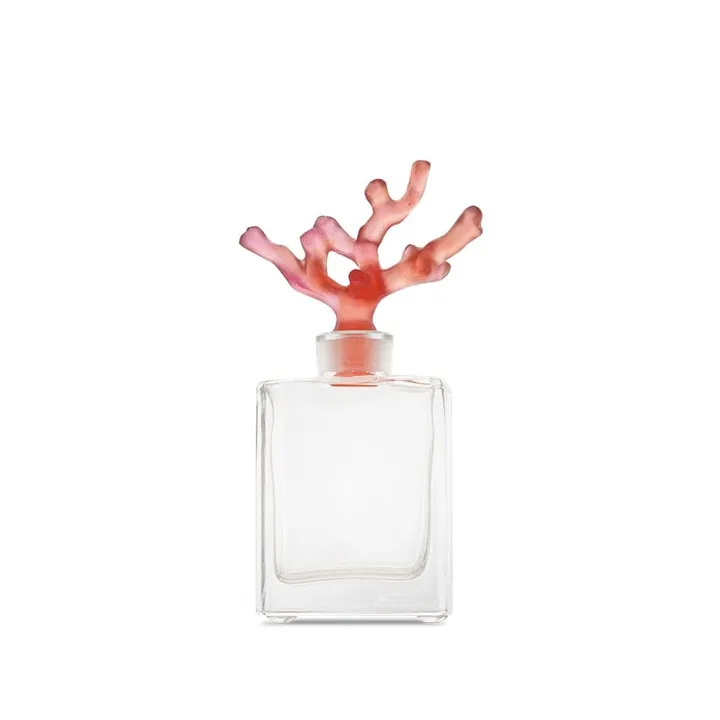 Flacon en cristal clair au bouchon en forme de branche de corail rose